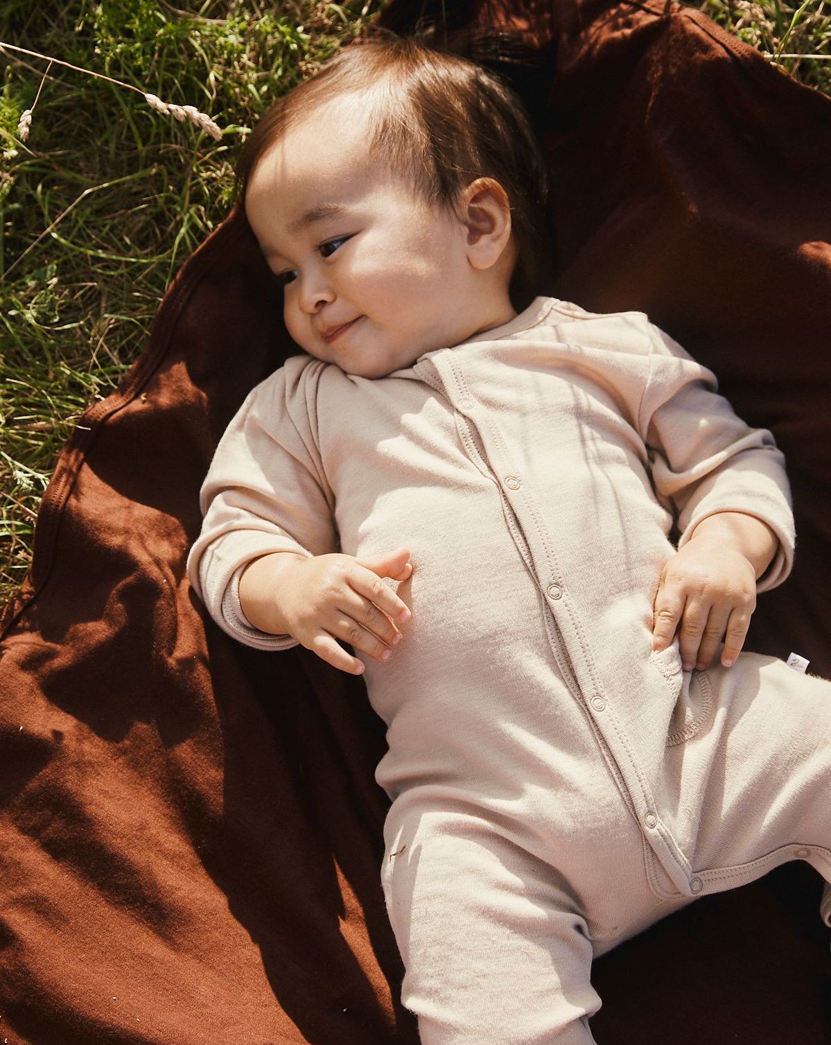 Baby i merino ulddragt